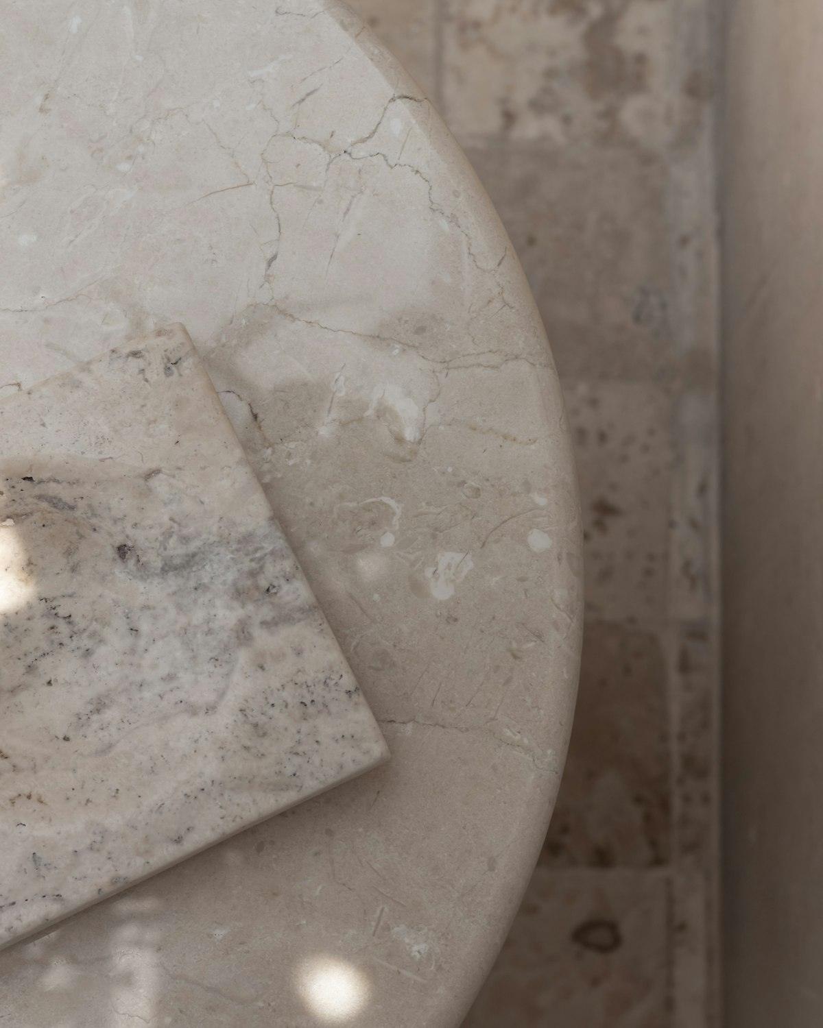 Marble slab samples on the templating table at the Pacific Range Counter Top fabrication shop in Vancouver